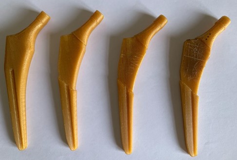 This picture shows various hip prosthesis prototypes on which these coatings have been successfully tested. It can be observed that the adhesion test does not detach the biocomposite from the substrate where it has been applied. 